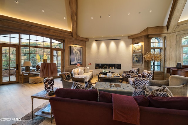 17 Chateau Ln Unit 501, Beaver Creek, CO 81620 - living area featuring high vaulted ceiling, light wood-style flooring, beam ceiling, and a fireplace