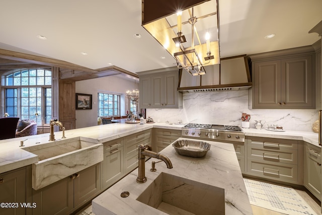 17 Chateau Ln Unit 501, Beaver Creek, CO 81620 - kitchen featuring a chandelier, custom exhaust hood, light stone counters, backsplash, and recessed lighting