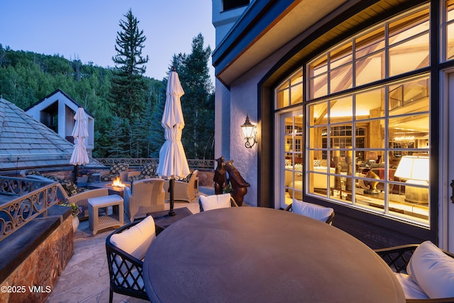 17 Chateau Ln Unit 501, Beaver Creek, CO 81620 - view of patio featuring outdoor dining area and an outdoor living space with a fire pit