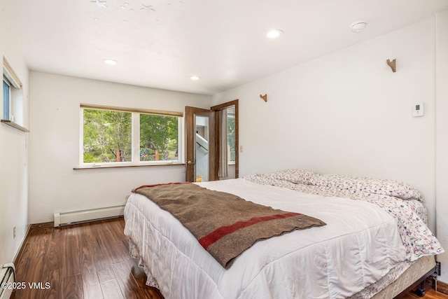 562 Main St, Minturn, CO 81645 - bedroom with a baseboard heating unit, a baseboard radiator, wood finished floors, and recessed lighting