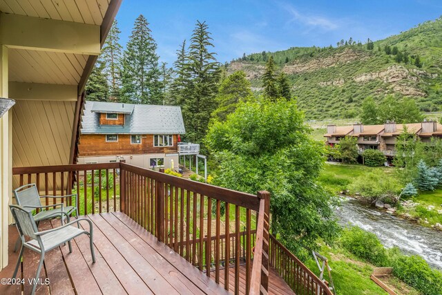 wooden deck with a water view