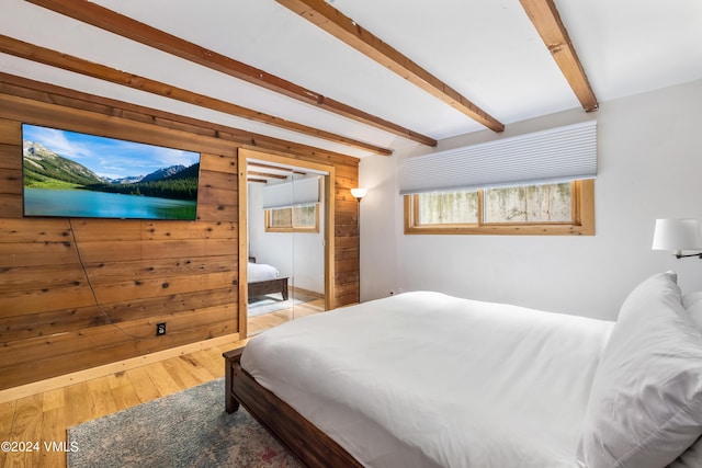 2963 Bellflower Dr, Vail, CO 81657 - bedroom with wood-type flooring, beamed ceiling, and wood walls