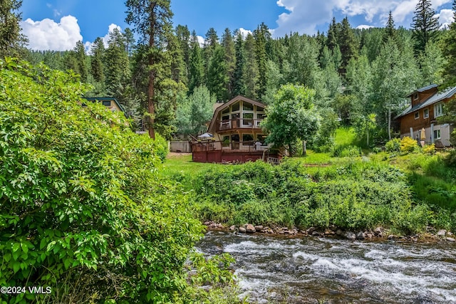 2963 Bellflower Dr, Vail, CO 81657 - view of yard with a deck with water view