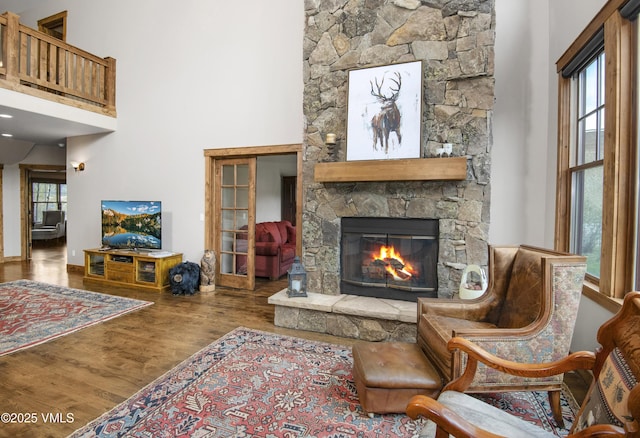 0017 Harvester Ct, Eagle, CO 81631 - living room with a stone fireplace, wood finished floors, and a towering ceiling