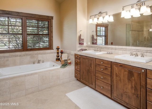 0017 Harvester Ct, Eagle, CO 81631 - bathroom featuring tile patterned floors, a bath, a stall shower, and double vanity
