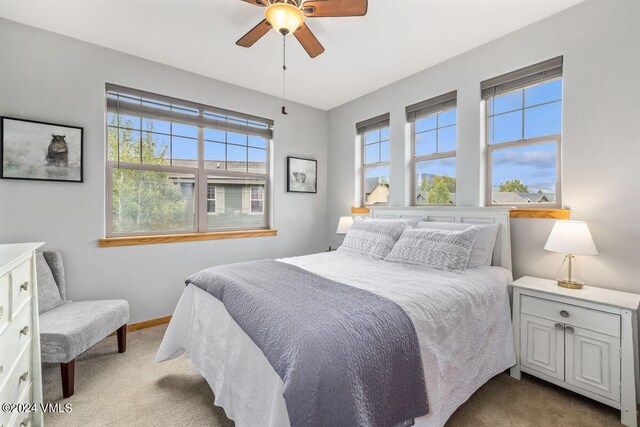 carpeted bedroom with ceiling fan