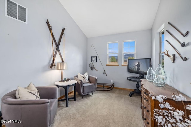 living area with light colored carpet