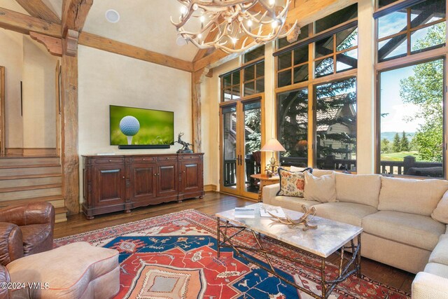 living room featuring hardwood / wood-style flooring and a notable chandelier