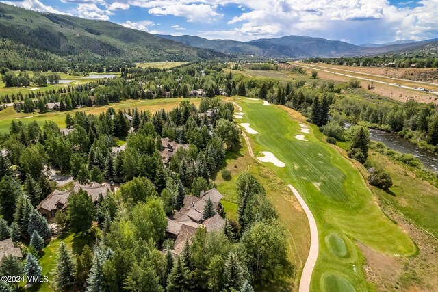 birds eye view of property featuring a mountain view