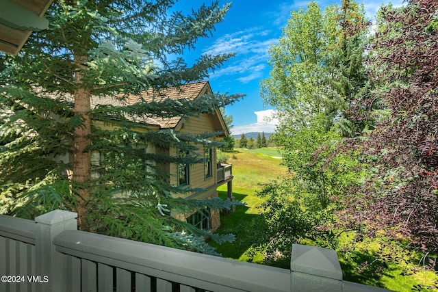 view of home's exterior with a lawn