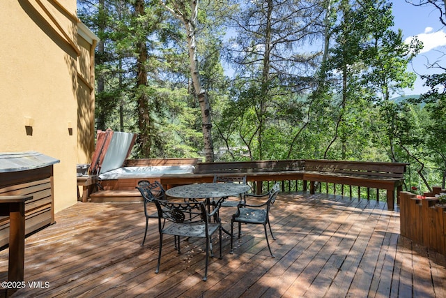 2111 Vermont Rd Unit A, Vail, CO 81657 - wooden terrace featuring a jacuzzi and outdoor dining space