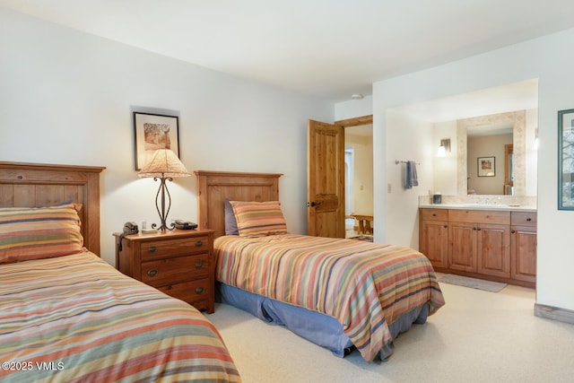 2111 Vermont Rd Unit A, Vail, CO 81657 - bedroom featuring light colored carpet and connected bathroom