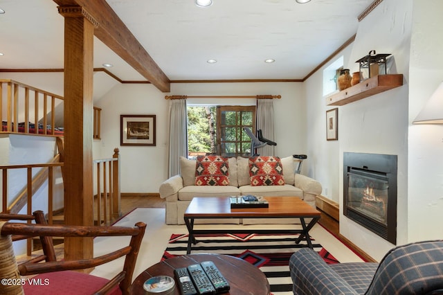 2111 Vermont Rd Unit A, Vail, CO 81657 - living area featuring wood finished floors, recessed lighting, ornamental molding, a glass covered fireplace, and beamed ceiling