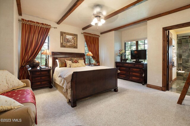 bedroom featuring ceiling fan, light colored carpet, and beam ceiling