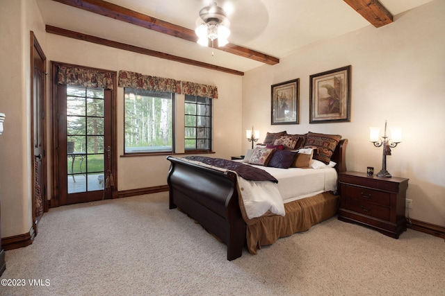 bedroom with ceiling fan, access to exterior, beam ceiling, and light carpet