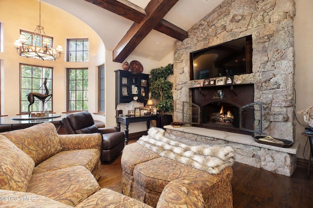 living room featuring a fireplace, a chandelier, hardwood / wood-style flooring, a high ceiling, and beam ceiling