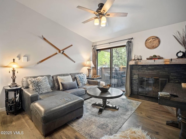 1061 W Beaver Creek Blvd Unit F-203, Avon, CO 81620 - living area featuring lofted ceiling, a ceiling fan, wood finished floors, and a fireplace