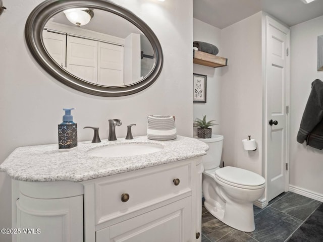 1061 W Beaver Creek Blvd Unit F-203, Avon, CO 81620 - bathroom featuring vanity, toilet, and baseboards