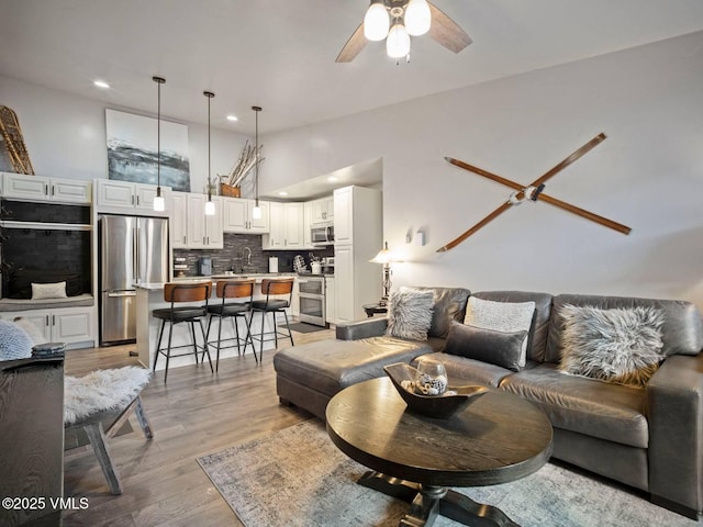 1061 W Beaver Creek Blvd Unit F-203, Avon, CO 81620 - living room featuring a ceiling fan, recessed lighting, and light wood-style flooring