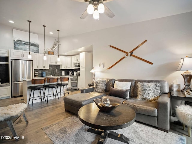 1061 W Beaver Creek Blvd Unit F-203, Avon, CO 81620 - living area featuring a ceiling fan, wood finished floors, recessed lighting, and lofted ceiling