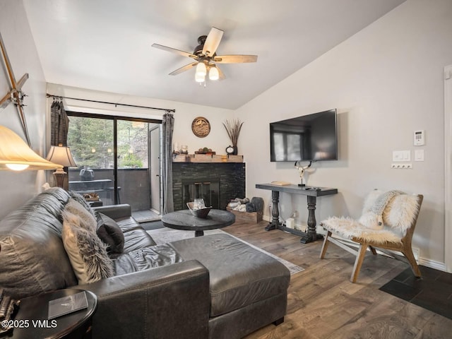 1061 W Beaver Creek Blvd Unit F-203, Avon, CO 81620 - living area featuring lofted ceiling, wood finished floors, baseboards, ceiling fan, and a fireplace