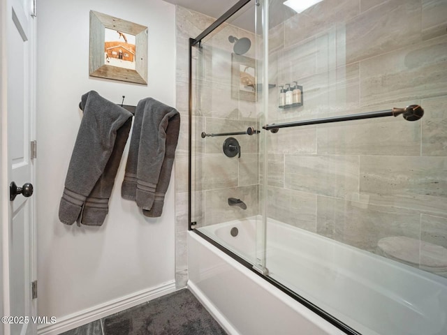 1061 W Beaver Creek Blvd Unit F-203, Avon, CO 81620 - bathroom featuring combined bath / shower with glass door and baseboards