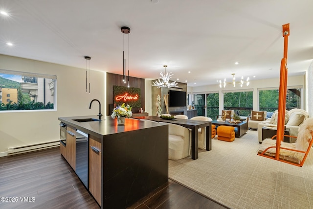 684 W Lionshead Cir Unit 302, Vail, CO 81657 - kitchen with baseboard heating, modern cabinets, a chandelier, recessed lighting, and open floor plan