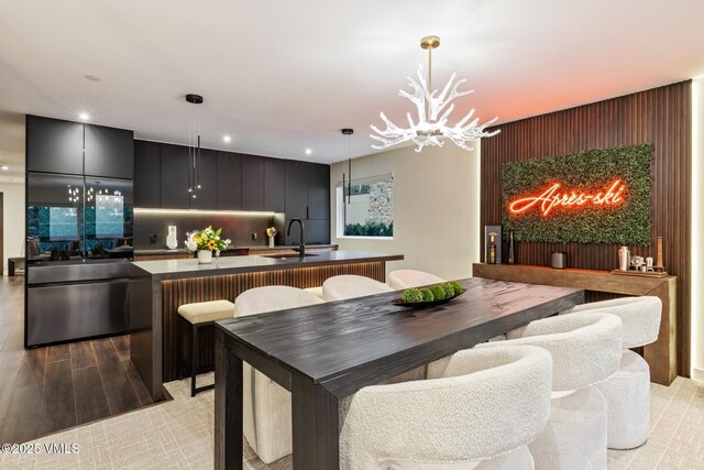 684 W Lionshead Cir Unit 302, Vail, CO 81657 - dining area with a chandelier, recessed lighting, and light wood-style floors