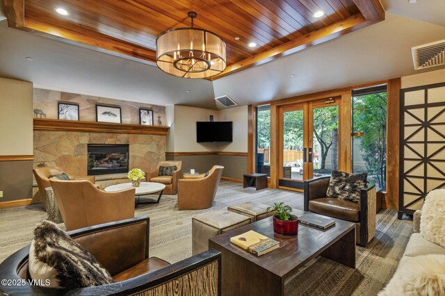 684 W Lionshead Cir Unit 302, Vail, CO 81657 - carpeted living room featuring wood ceiling, a fireplace, a tray ceiling, recessed lighting, and french doors