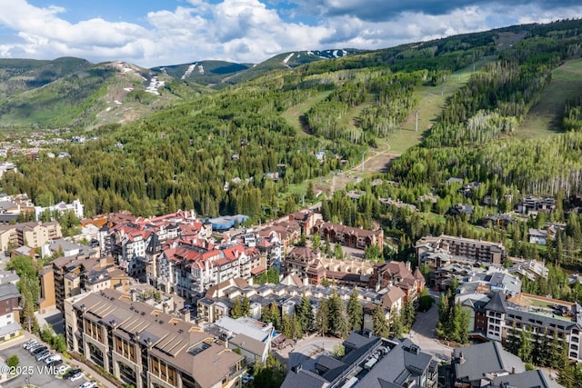 684 W Lionshead Cir Unit 302, Vail, CO 81657 - aerial overview of property's location with a mountain backdrop and a forest
