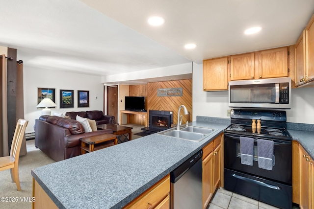 423 Wild Irishman Rd Unit 1008 1009, Keystone, CO 80435 - kitchen with stainless steel appliances, open floor plan, a peninsula, a warm lit fireplace, and recessed lighting