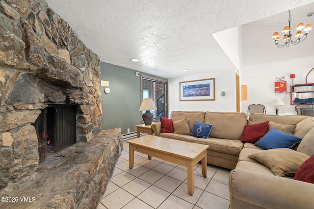 423 Wild Irishman Rd Unit 1008 1009, Keystone, CO 80435 - living area with a textured ceiling, light tile patterned flooring, a chandelier, a stone fireplace, and a baseboard radiator