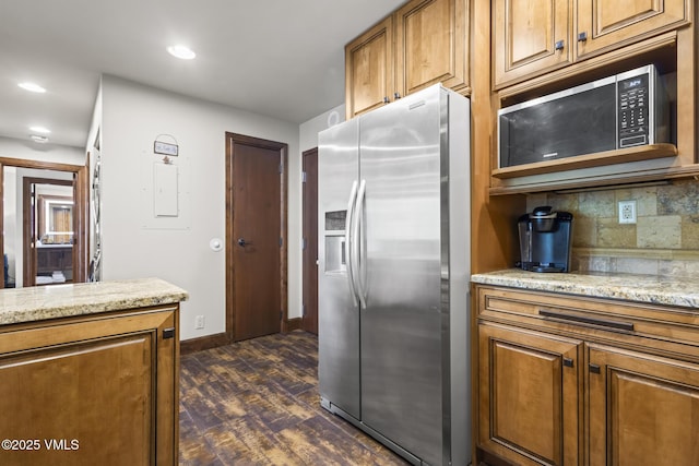 1100 N Frontage Rd W Unit 2504, Vail, CO 81657 - kitchen featuring stainless steel appliances, dark wood-style flooring, brown cabinets, decorative backsplash, and recessed lighting