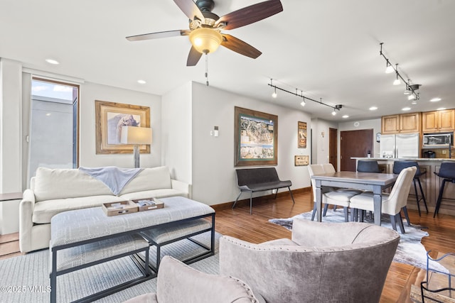1100 N Frontage Rd W Unit 2504, Vail, CO 81657 - living room featuring rail lighting, wood finished floors, ceiling fan, and recessed lighting