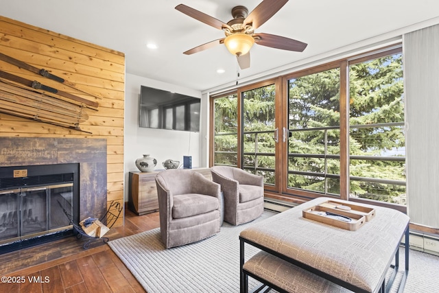 1100 N Frontage Rd W Unit 2504, Vail, CO 81657 - living area with plenty of natural light, hardwood / wood-style floors, a ceiling fan, recessed lighting, and a tile fireplace
