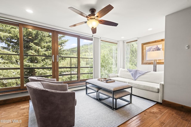 1100 N Frontage Rd W Unit 2504, Vail, CO 81657 - living room featuring plenty of natural light, a ceiling fan, light wood-type flooring, and recessed lighting
