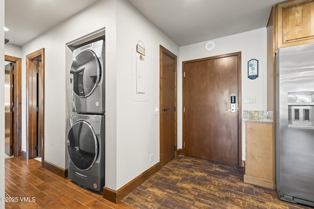 1100 N Frontage Rd W Unit 2504, Vail, CO 81657 - laundry area featuring stacked washing machine and dryer and dark wood-type flooring