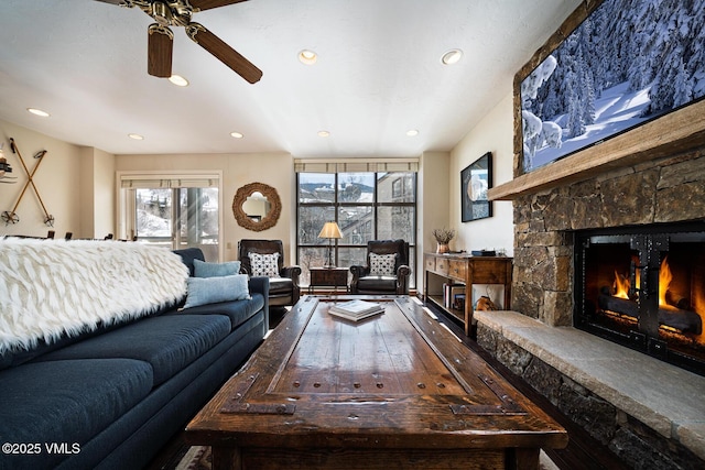 living room featuring recessed lighting and a fireplace