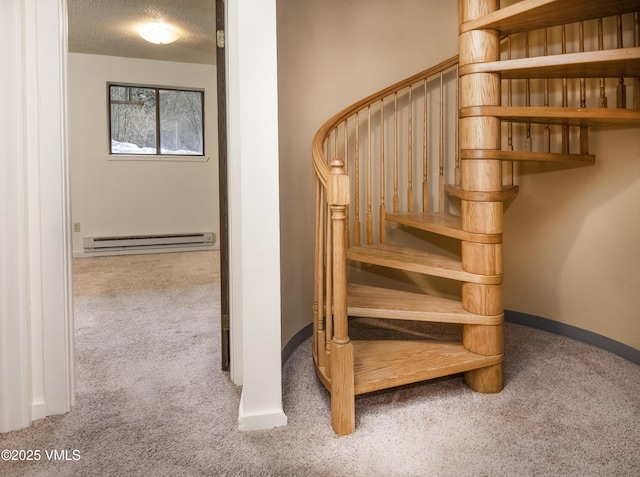staircase with a textured ceiling, carpet flooring, baseboard heating, and baseboards