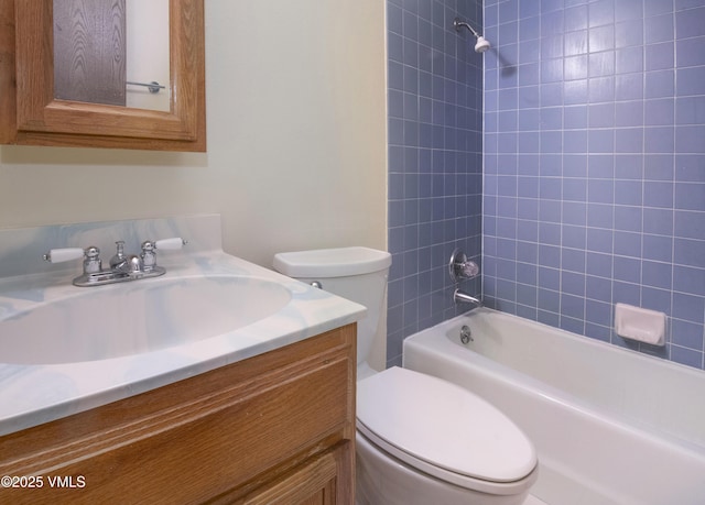 bathroom with vanity, toilet, and tub / shower combination