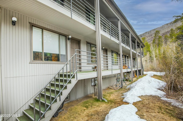 5197 Black Gore Dr Unit B-2, Vail, CO 81657 - view of side of home featuring stairs and a mountain view