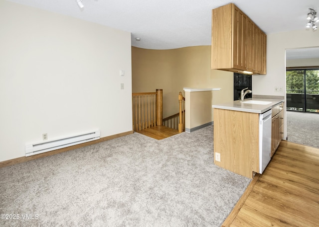 kitchen featuring a sink, white dishwasher, light carpet, light countertops, and a baseboard radiator