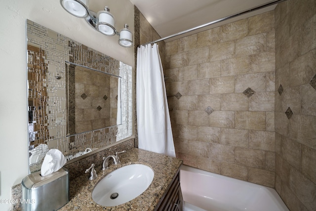 full bath with shower / tub combo with curtain and vanity