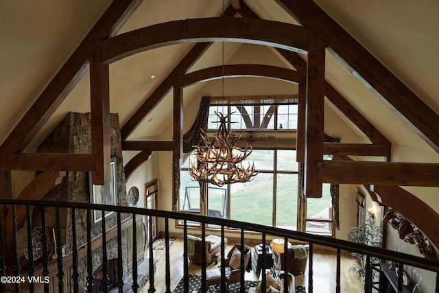 room details with beam ceiling and a notable chandelier