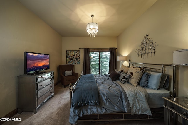 bedroom with a chandelier, carpet, and baseboards