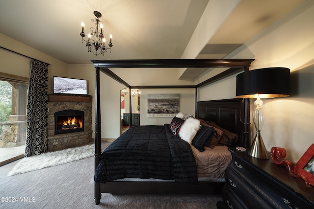 bedroom with an inviting chandelier, carpet, and a fireplace