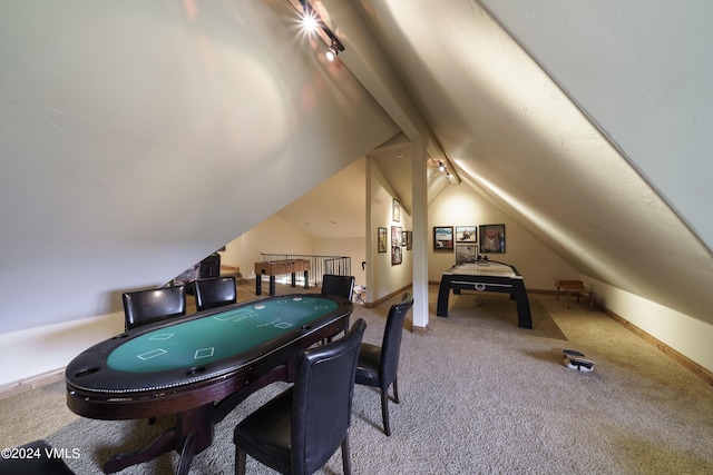 rec room with carpet floors, lofted ceiling, and baseboards