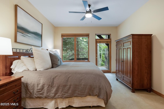 627 Sawatch Dr Unit 105, Edwards, CO 81632 - bedroom featuring access to exterior, light colored carpet, and ceiling fan