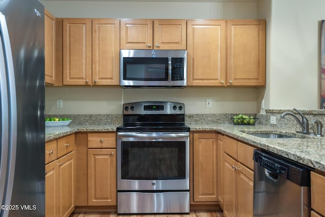 627 Sawatch Dr Unit 105, Edwards, CO 81632 - kitchen featuring stainless steel appliances and light stone countertops