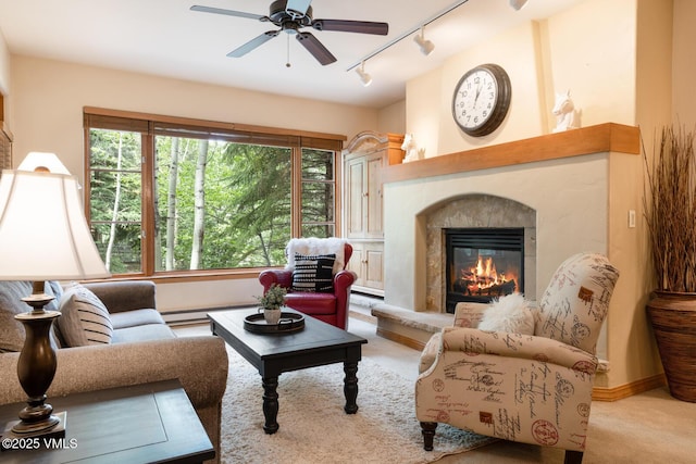 627 Sawatch Dr Unit 105, Edwards, CO 81632 - carpeted living area featuring rail lighting, ceiling fan, baseboard heating, and a fireplace